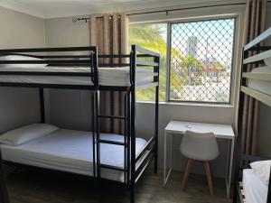 Ένα ή περισσότερα κρεβάτια σε δωμάτιο στο Homely Inn Hostel