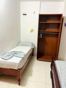 מיטה או מיטות בחדר ב-Apartamento Palis 3 C