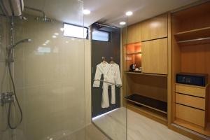 a bathroom with a shower and a glass shower stall at Bubu Resort in Perhentian Islands