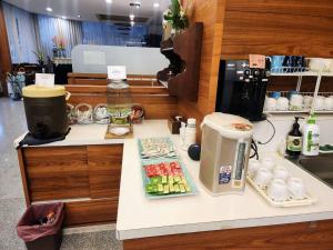 Kuchyň nebo kuchyňský kout v ubytování Jia-Jia Business Hotel