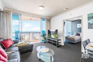 a living room with a view of the ocean at 2 Bedroom 1 Bathroom Apartment - Centre of Surfers Paradise, Chevron Renaissance in Gold Coast