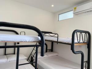 a couple of bunk beds in a room at Casa Hawai in Melgar +13 photos