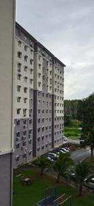 a large apartment building with a playground in front of it at Homestay Putrajaya , Icha Homestay Presint 9 in Putrajaya