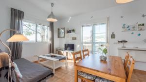a living room with a table and a dining room at Casa Ronda Vélez-Málaga by Ruralidays in Vélez-Málaga