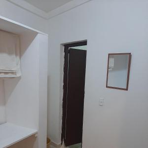 a room with a black door and a mirror at B&B KeisyAlba Punta Rucia in Punta Rucia +116 photos