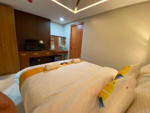 Postel nebo postele na pokoji v ubytování NGN Gran Hotel