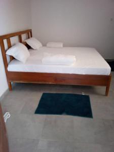 Postel nebo postele na pokoji v ubytování Iknews Appart Dakar