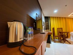 a coffee maker sitting on a counter in a kitchen at NGN Gran Hotel in Tuguegarao City