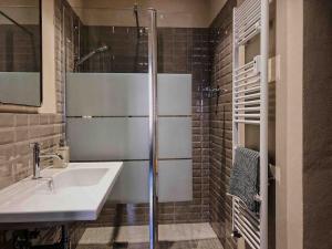 a bathroom with a sink and a shower at Appartamento design dèco in Bologna