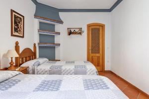 A bed or beds in a room at CASAMORA Cerca del Caminito del Rey