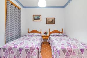 A bed or beds in a room at CASAMORA Cerca del Caminito del Rey