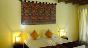 Voodi või voodid majutusasutuse Giman Free Beach Resort toas