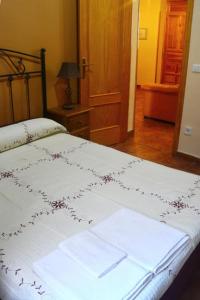 Säng eller sängar i ett rum på Casa Rural Concejo 1