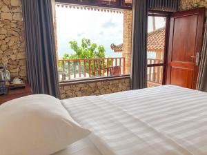 Ένα ή περισσότερα κρεβάτια σε δωμάτιο στο Edge Resort, Yogyakarta