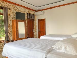 Ένα ή περισσότερα κρεβάτια σε δωμάτιο στο Edge Resort, Yogyakarta