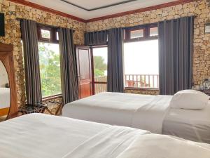 Ένα ή περισσότερα κρεβάτια σε δωμάτιο στο Edge Resort, Yogyakarta
