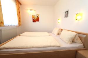 Posteľ alebo postele v izbe v ubytovaní Ferienhaus Brandacher
