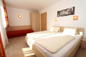 Posteľ alebo postele v izbe v ubytovaní Ferienhaus Brandacher