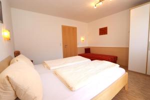Posteľ alebo postele v izbe v ubytovaní Ferienhaus Brandacher
