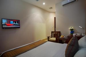TV a/nebo společenská místnost v ubytování Vong Xua Boutique Hotel