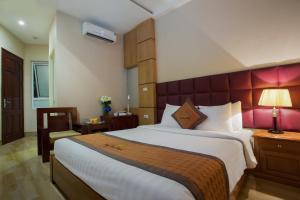 Postel nebo postele na pokoji v ubytování Vong Xua Boutique Hotel