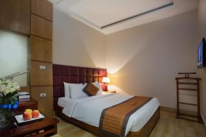 Postel nebo postele na pokoji v ubytování Vong Xua Boutique Hotel