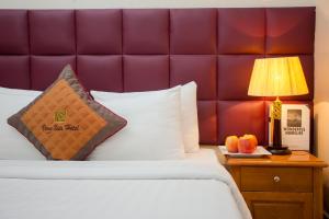 Postel nebo postele na pokoji v ubytování Vong Xua Boutique Hotel