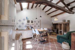 a kitchen and dining room with a table and chairs at A Casa de Andrea in A Coruña