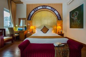 Postel nebo postele na pokoji v ubytování Vong Xua Boutique Hotel