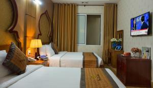 Een bed of bedden in een kamer bij Vong Xua Boutique Hotel