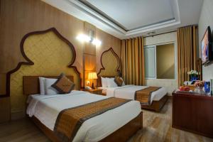 Een bed of bedden in een kamer bij Vong Xua Boutique Hotel