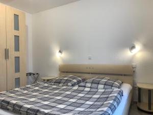 Postel nebo postele na pokoji v ubytování Jordsand