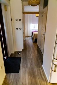 a hallway of a room with a room with a bed at Mukava saunallinen kaksio omalla sisäänkäynnillä ja ilmaisella autopaikalla in Kuopio +32 photos