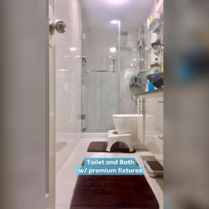 a bathroom with a toilet and a walk in shower at Staycation at The Avenue Residences by Melo in Manila