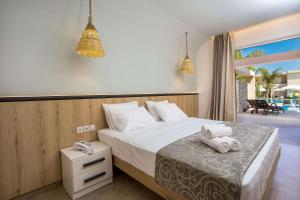 Postel nebo postele na pokoji v ubytování Venezia Resort Hotel & Spa
