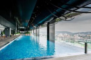 a swimming pool on the top of a building at Entire Apartment in Kuala Lumpur in Kuala Lumpur