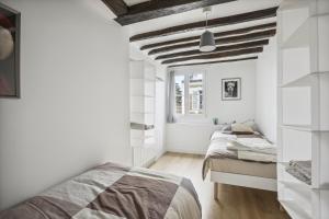 Posteľ alebo postele v izbe v ubytovaní Le Montreuil- Versailles