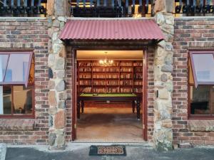 a brick building with a room filled with books at Stone Castle, Dullstroom Country Estate in Dullstroom