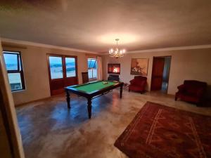 a living room with a pool table in it at Stone Castle, Dullstroom Country Estate in Dullstroom