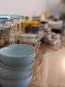 a group of jars sitting on a table at Clarence House in Keswick