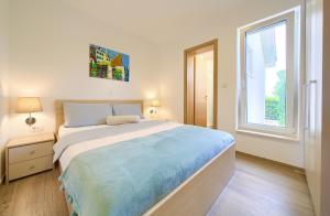 Postel nebo postele na pokoji v ubytování Villa Gardena + 37 fotografií