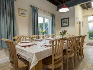 a dining room with a table and chairs at Harbour View - Ukc2303 in Wainfleet All Saints