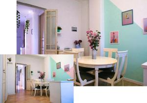 バレンシアにあるRuzafa Apartmentのテーブルとダイニングルームが備わる客室です。