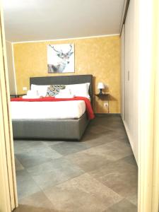 a bedroom with a large bed and a tiled floor at TORINO VACANCY 4 - Bridge House in Turin