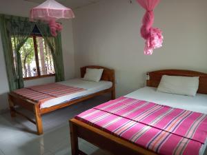 Voodi või voodid majutusasutuse Hotel Sea Shadow toas