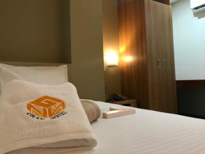 Postel nebo postele na pokoji v ubytování NGN Gran Hotel