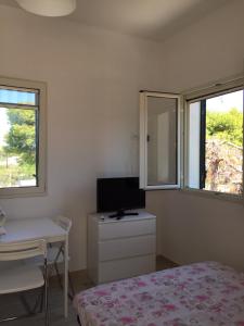 TV a/nebo společenská místnost v ubytování One Love apartments