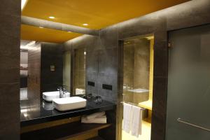 a bathroom with a sink and a mirror at Hotel Luve in San Antonio de Banageber