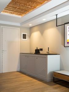 a reception desk in a room with a ceiling at Artree Suites in Heraklio Town