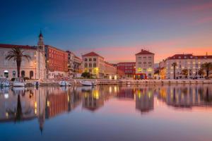 a city with a large body of water with buildings at Guest house Ivona in Split